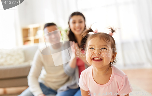 Image of happy baby girl and parents at home