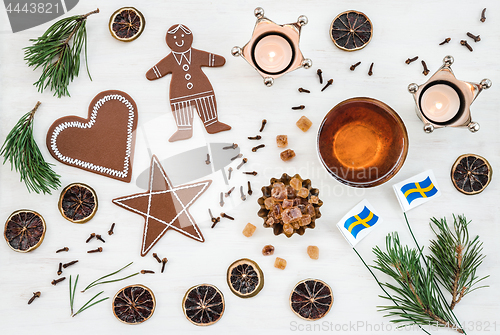 Image of Swedish Christmas decor with flags, candles and ginger biscuits