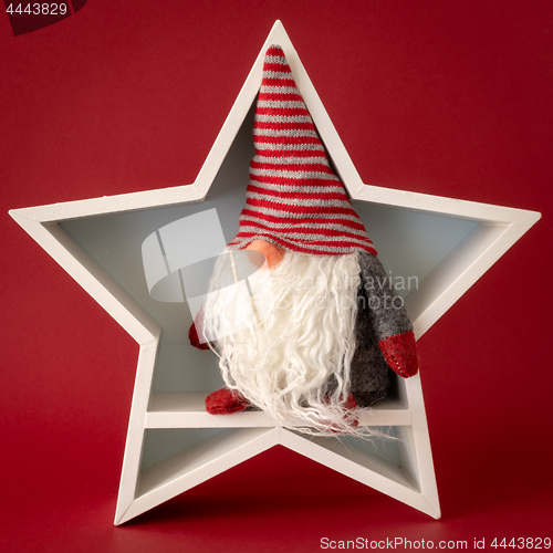 Image of Christmas decoration white star with a gnome inside