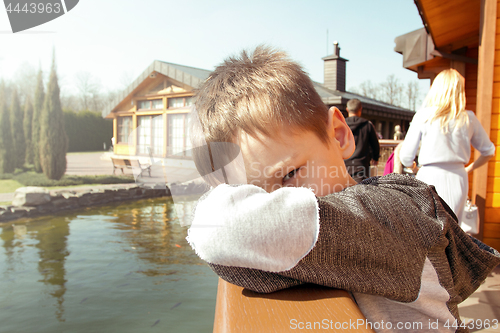 Image of Boy in the park by the lake