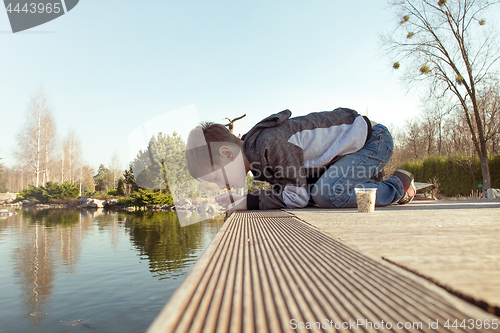 Image of Boy in the park by the lake