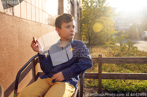 Image of Boy eating sweets