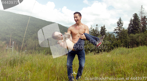 Image of Father and son have fun outdoors