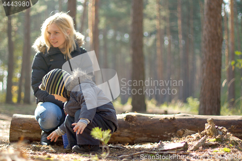 Image of Mother and son it the forest