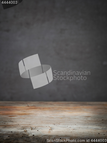 Image of wooden table and grey wall