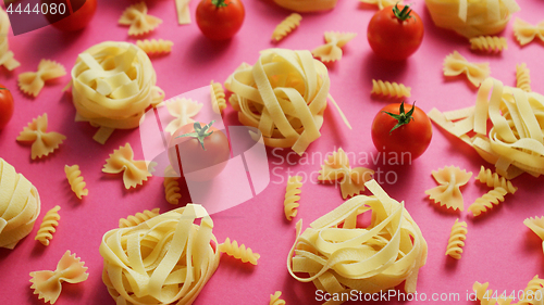 Image of Uncooked pasta with fresh tomatoes