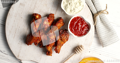 Image of Fried chicken wings on board