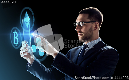 Image of businessman with tablet pc and cryptocurrency