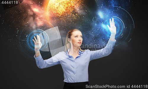 Image of businesswoman with virtual space hologram