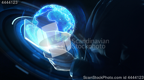 Image of businessman with tablet pc and earth hologram