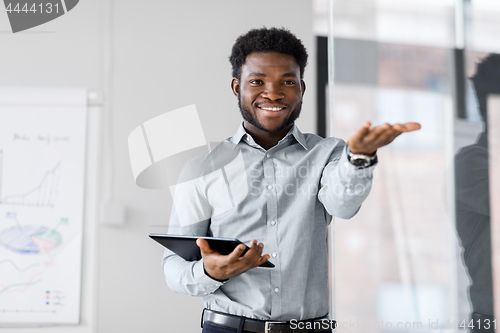 Image of businessman with tablet pc at office presentation