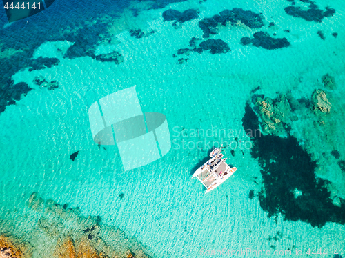 Image of Drone aerial view of catamaran sailing boat in Maddalena Archipelago, Sardinia, Italy.