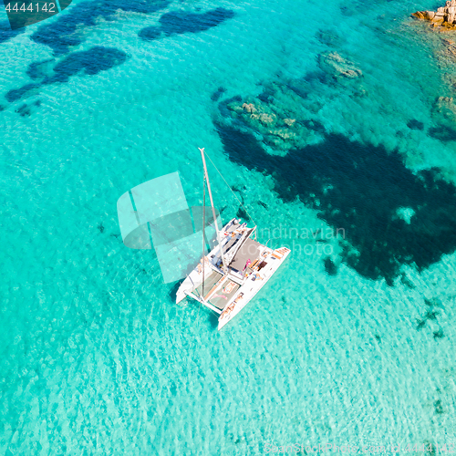 Image of Drone aerial view of catamaran sailing boat in Maddalena Archipelago, Sardinia, Italy.