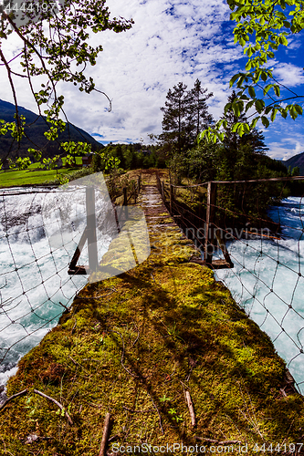 Image of Suspension bridge over the mountain river, Norway.