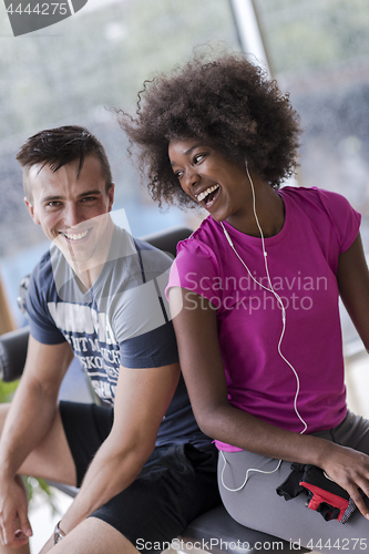 Image of couple in a gym have break