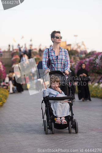 Image of mother and daughter in flower garden