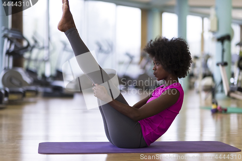 Image of african american woman exercise yoga in gym