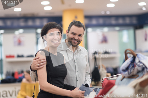 Image of couple chooses shoes At Shoe Store