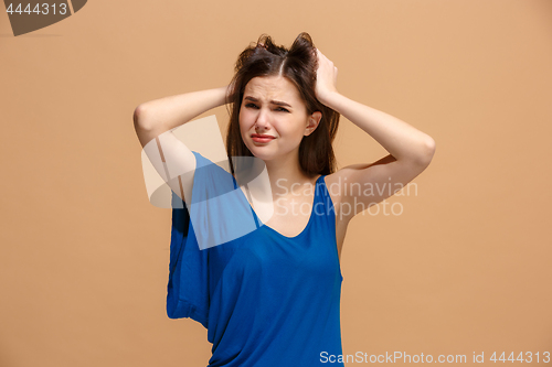 Image of Beautiful woman in stress isolated on pastel