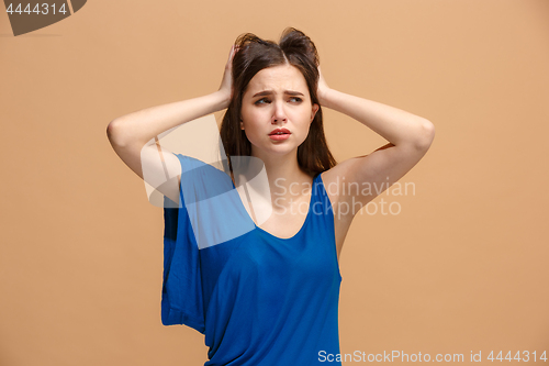 Image of Beautiful woman in stress isolated on pastel