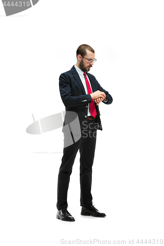 Image of businessman looking at his watch on his hand, watching the time