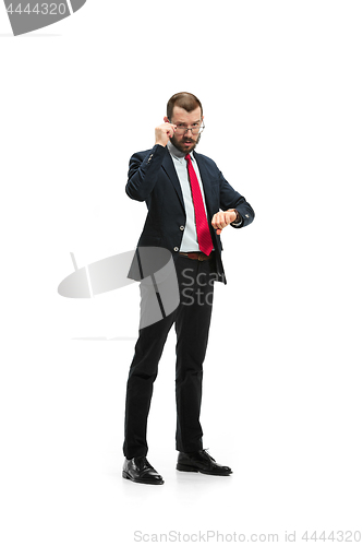 Image of businessman looking at his watch on his hand, watching the time