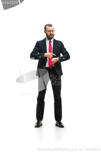 Image of businessman looking at his watch on his hand, watching the time