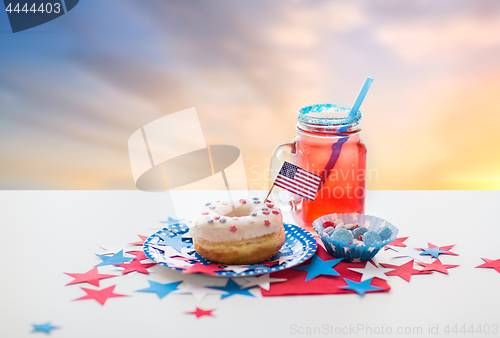 Image of donut with juice and candies on independence day