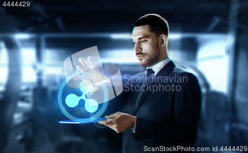 Image of businessman with tablet pc and ripple hologram