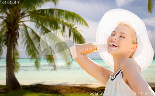 Image of beautiful woman enjoying summer over beach