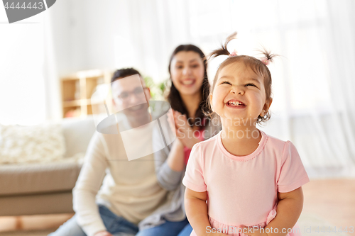 Image of happy baby girl and parents at home