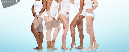 Image of group of happy diverse women in white underwear