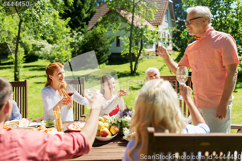 Image of family gathering at summer garden and celebration