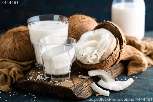 Image of Fresh coconut milk in glass bottle, vegan non dairy healthy drin