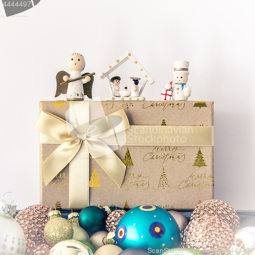 Image of Christmas decoration with wooden figures glass balls and gift bo