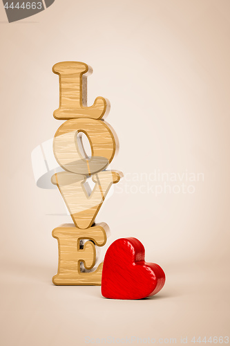 Image of The word love and a red heart made of wood