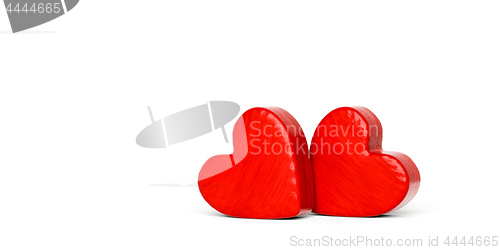 Image of Two red wooden hearts on a white background