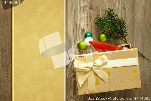 Image of christmas decoration background with a gift on wooden background