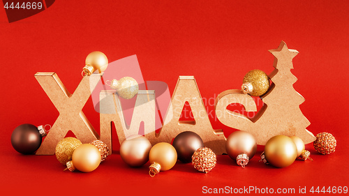 Image of Christmas decoration with xmas text and some glass balls