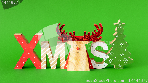 Image of Christmas decoration with xmas text and a reindeer
