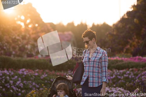 Image of mother and daughter in flower garden