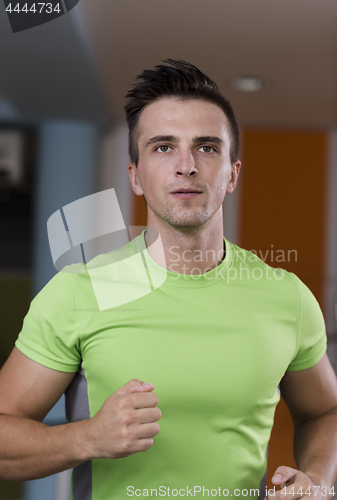 Image of sportsman exercise jogging on treadmill