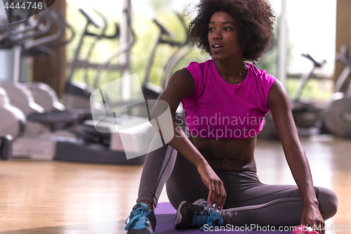 Image of african american woman exercise yoga in gym