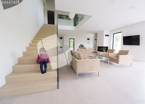 Image of family with little girl enjoys in the modern living room