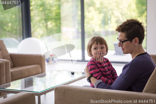 Image of mother and cute little girl enjoying their free time