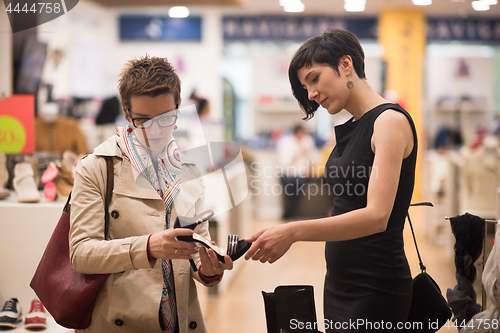 Image of best friend shopping in big mall