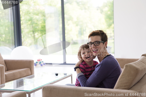 Image of mother and cute little girl enjoying their free time