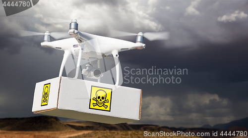 Image of Unmanned Aircraft System (UAV) Quadcopter Drone Carrying Package