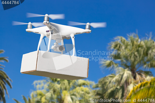 Image of Unmanned Aircraft System (UAV) Quadcopter Drone Carrying Blank P