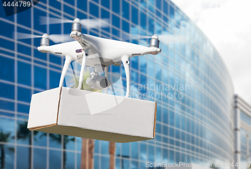 Image of Unmanned Aircraft System (UAS) Quadcopter Drone Carrying Blank P